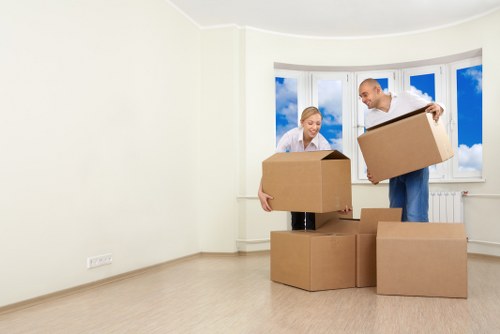 Professional movers handling furniture in an Aberdeen flat