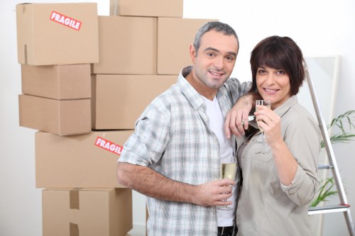 Professional movers carrying boxes in an Aberdeen street